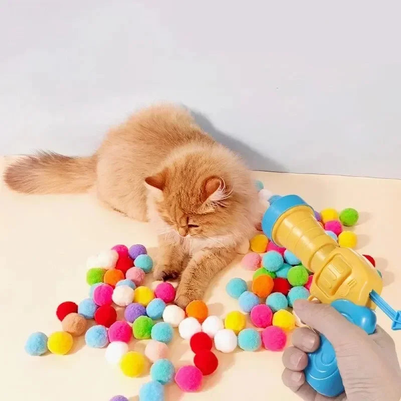 Juguete para gatos: pistola y pelotas